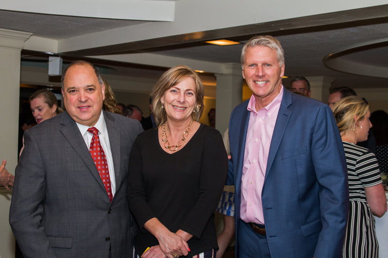 Partners, members, and guests meet at a special reception with Lt. Gov. Polito